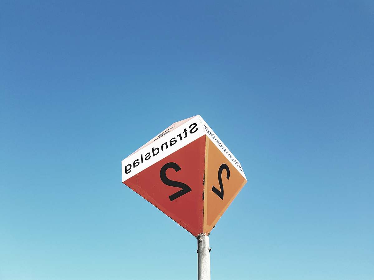road sign worm's eye view of Strandslag 2 signage street sign